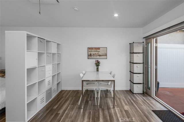 interior space with dark wood-type flooring and baseboards