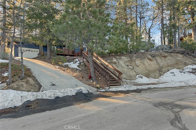 view of front of home featuring a garage and stairs