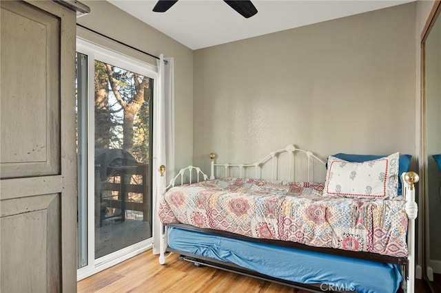 bedroom featuring wood finished floors and ceiling fan