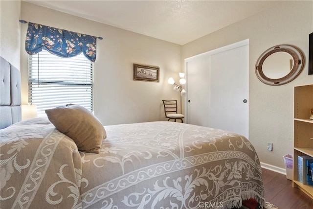 22690 Mountain View Rd, Moreno Valley, CA 92557 - bedroom with baseboards, wood finished floors, and a closet