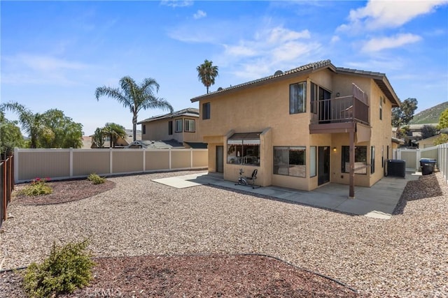 22690 Mountain View Rd, Moreno Valley, CA 92557 - rear view of property with central AC, stucco siding, a fenced backyard, a patio area, and a balcony