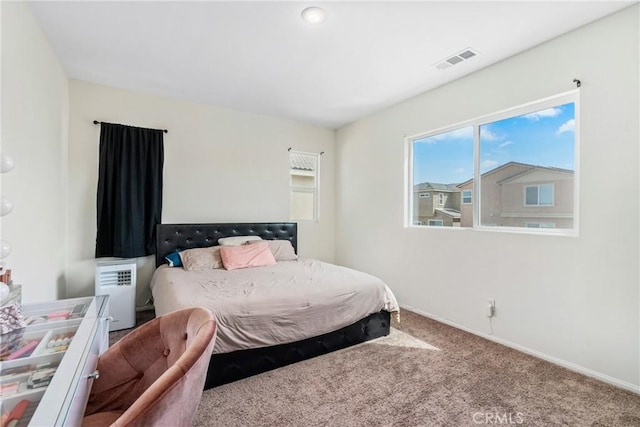 bedroom featuring carpet, visible vents, and baseboards