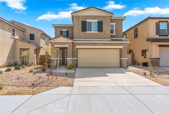 view of front of home featuring a garage, driveway, cooling unit, and stucco siding