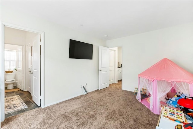 rec room featuring baseboards and carpet