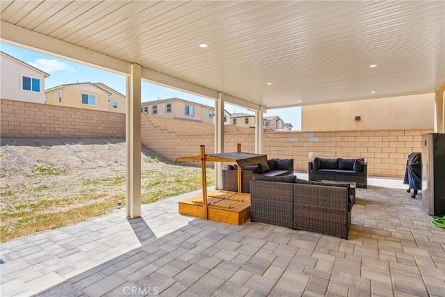 view of patio with outdoor lounge area and a fenced backyard