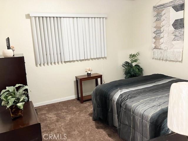 242 E 116th St, Los Angeles, CA 90061 - carpeted bedroom with baseboards