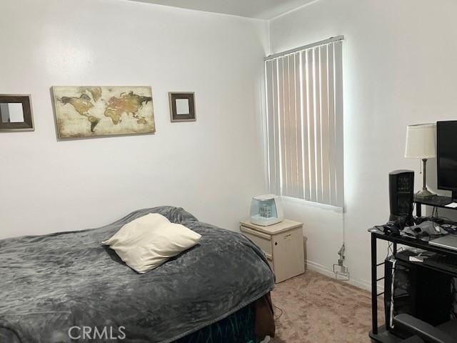 242 E 116th St, Los Angeles, CA 90061 - bedroom featuring light colored carpet and baseboards