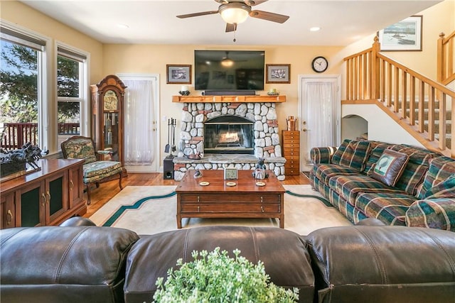 1251 Kodiak Dr, Lake Arrowhead, CA 92352 - living room with wood finished floors, a ceiling fan, a stone fireplace, stairs, and recessed lighting