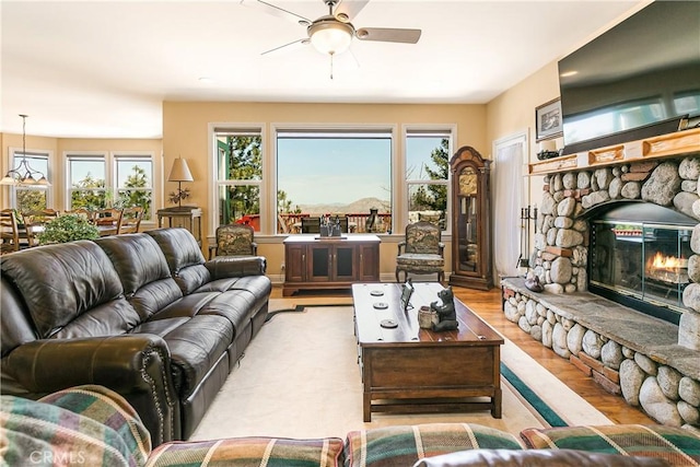 1251 Kodiak Dr, Lake Arrowhead, CA 92352 - living room with a ceiling fan, wood finished floors, and a fireplace