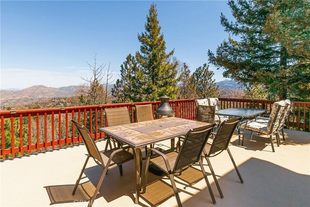 1251 Kodiak Dr, Lake Arrowhead, CA 92352 - view of patio featuring outdoor dining area and a mountain view