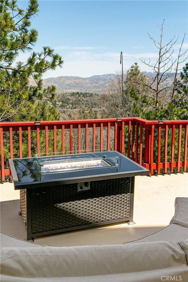 1251 Kodiak Dr, Lake Arrowhead, CA 92352 - wooden deck featuring an outdoor fire pit and a mountain view