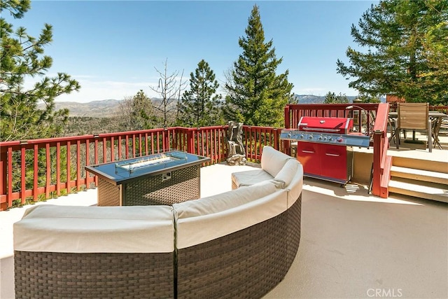 1251 Kodiak Dr, Lake Arrowhead, CA 92352 - deck with an outdoor living space and a mountain view