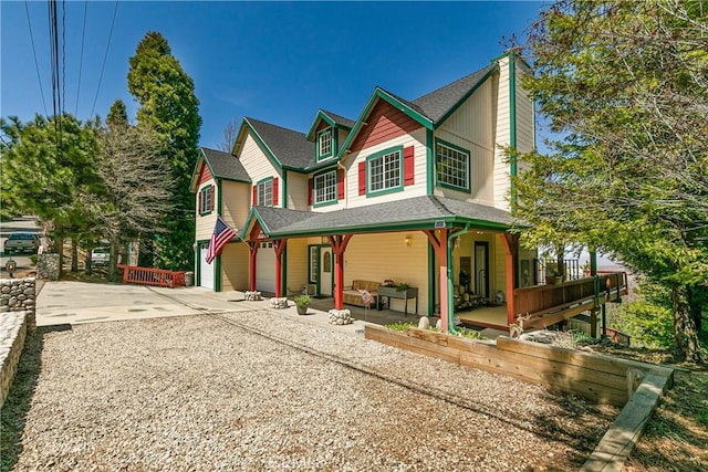1251 Kodiak Dr, Lake Arrowhead, CA 92352 - view of front of property with covered porch, concrete driveway, a chimney, and roof with shingles