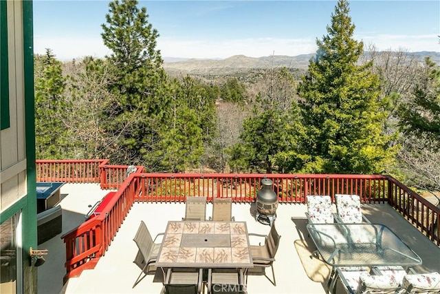 1251 Kodiak Dr, Lake Arrowhead, CA 92352 - deck featuring a mountain view and outdoor dining area