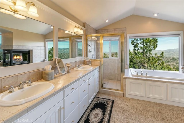 1251 Kodiak Dr, Lake Arrowhead, CA 92352 - full bathroom featuring a garden tub, vaulted ceiling, a sink, and a stall shower