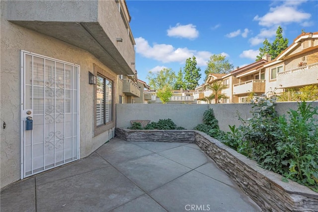 view of patio with a residential view and a fenced backyard