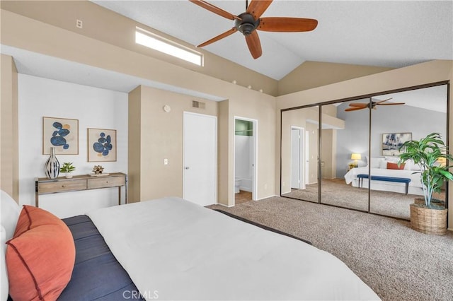 carpeted bedroom featuring visible vents, a ceiling fan, a closet, and vaulted ceiling