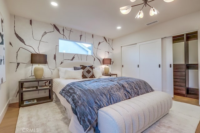 4903 Spencer St, Torrance, CA 90503 - bedroom featuring a closet, visible vents, recessed lighting, a chandelier, and wood finished floors