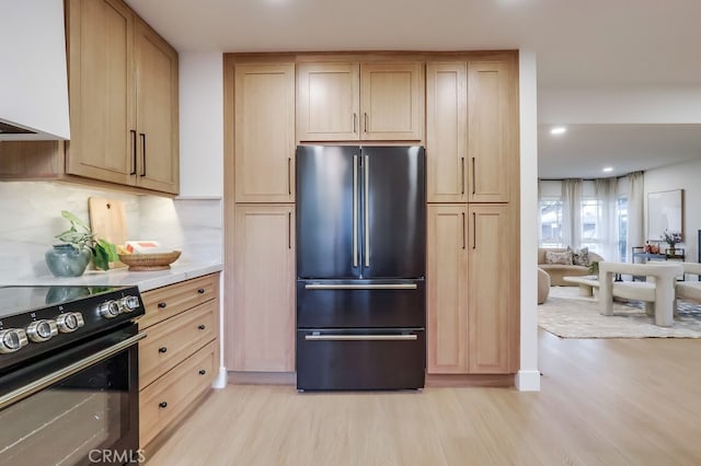 4903 Spencer St, Torrance, CA 90503 - kitchen featuring tasteful backsplash, light wood-style flooring, light countertops, black appliances, and light brown cabinetry