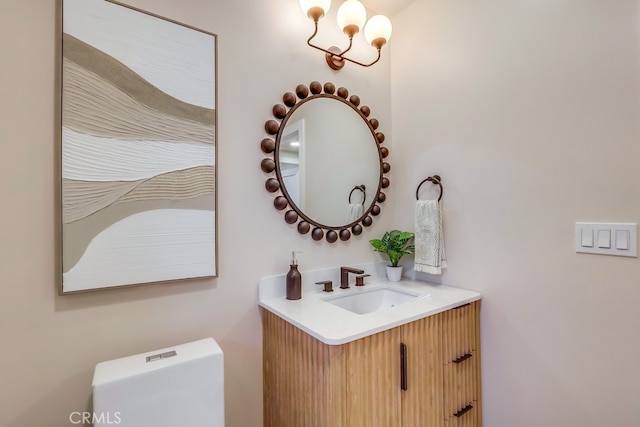 4903 Spencer St, Torrance, CA 90503 - half bath featuring toilet, an inviting chandelier, and vanity