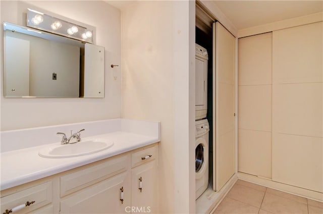 606 Avenida Sevilla Unit O, Laguna Woods, CA 92637 - bathroom with tile patterned flooring, stacked washing maching and dryer, and vanity
