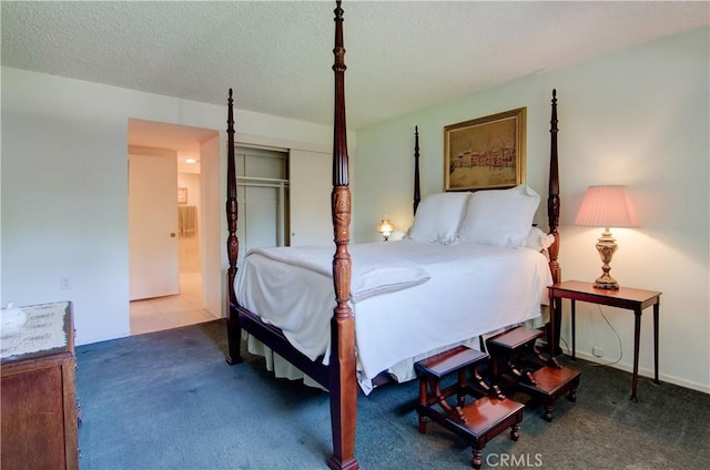 606 Avenida Sevilla Unit O, Laguna Woods, CA 92637 - carpeted bedroom with a closet and a textured ceiling