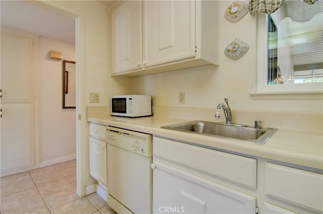 606 Avenida Sevilla Unit O, Laguna Woods, CA 92637 - kitchen with white appliances, light countertops, light tile patterned flooring, white cabinets, and a sink
