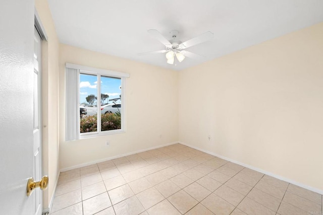 unfurnished room featuring baseboards and a ceiling fan