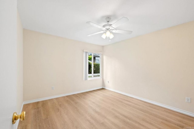 empty room with light wood-type flooring, baseboards, and ceiling fan