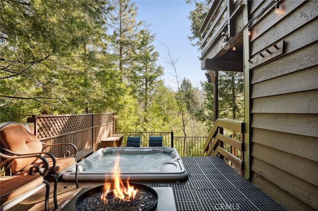 229 Chippewa Ln, Lake Arrowhead, CA 92352 - wooden deck featuring an outdoor fire pit