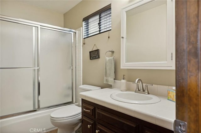 229 Chippewa Ln, Lake Arrowhead, CA 92352 - full bathroom with toilet, vanity, and bath / shower combo with glass door