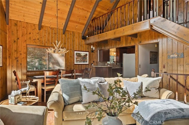 229 Chippewa Ln, Lake Arrowhead, CA 92352 - living room featuring a chandelier, wood ceiling, high vaulted ceiling, and wood walls