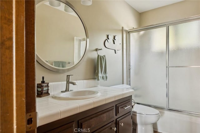 229 Chippewa Ln, Lake Arrowhead, CA 92352 - full bath featuring combined bath / shower with glass door, toilet, and vanity