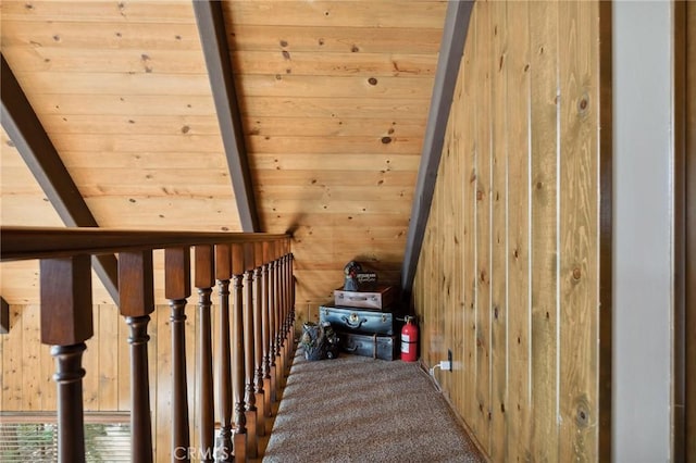 229 Chippewa Ln, Lake Arrowhead, CA 92352 - stairs featuring wooden walls, lofted ceiling with beams, wooden ceiling, and carpet floors