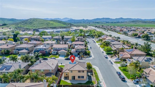 drone / aerial view with a residential view and a mountain view