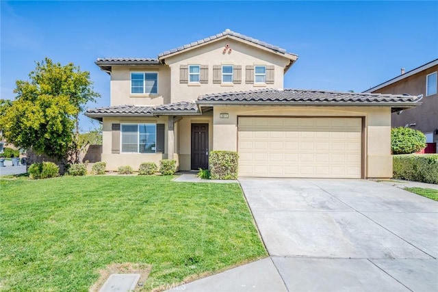 mediterranean / spanish house with driveway, a front lawn, stucco siding, and a tile roof