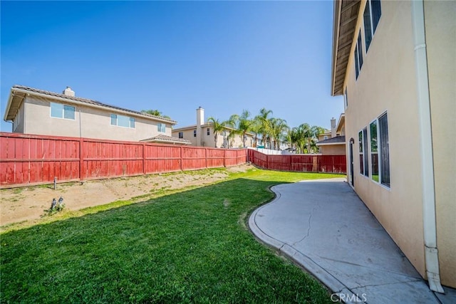 view of yard with a fenced backyard