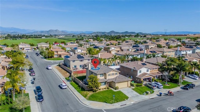 drone / aerial view with a residential view and a mountain view