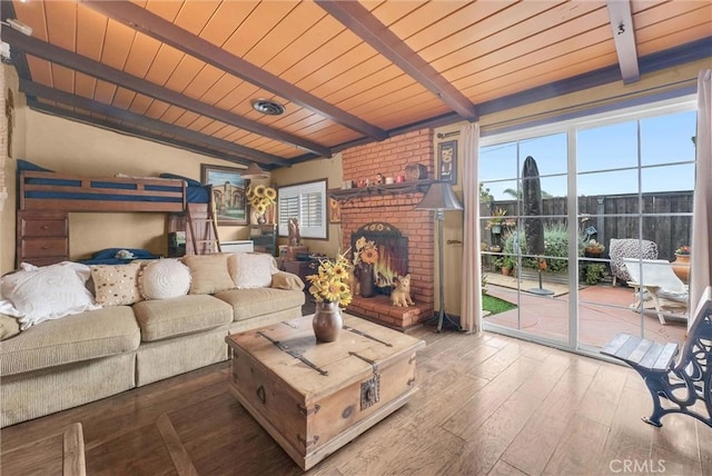 living area with wooden ceiling, a fireplace, lofted ceiling with beams, and wood finished floors