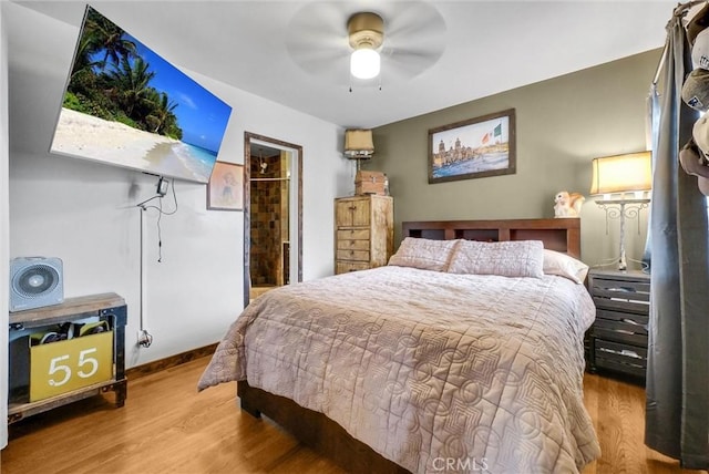 bedroom featuring a ceiling fan and wood finished floors