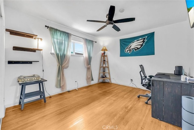 office area featuring wood finished floors and a ceiling fan