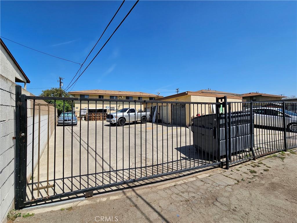 view of gate with fence