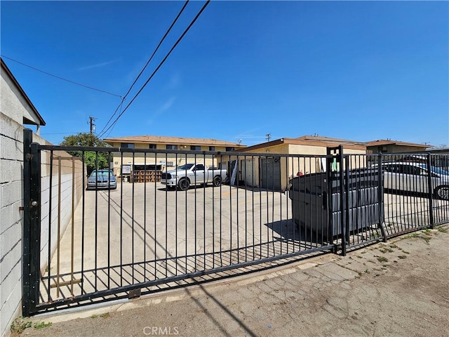 view of gate with fence