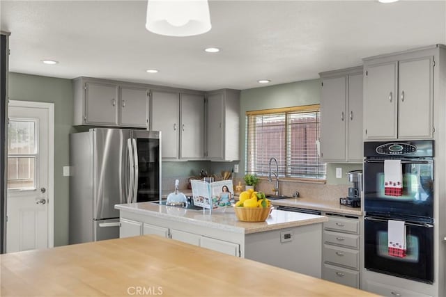 88611/2 Los Coches Rd, Lakeside, CA 92040 - kitchen with a sink, light countertops, dobule oven black, gray cabinets, and smart refrigerator