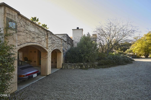 3450 Thacher Rd, Ojai, CA 93023 - view of side of property with a chimney and stucco siding