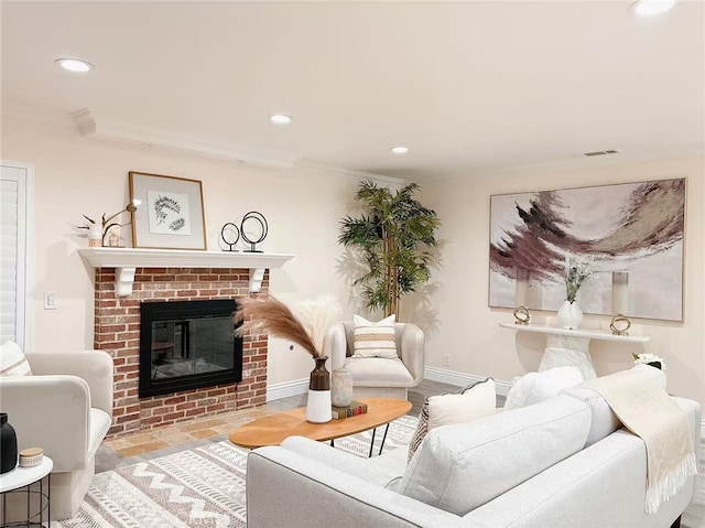 living area with crown molding, baseboards, recessed lighting, and a fireplace