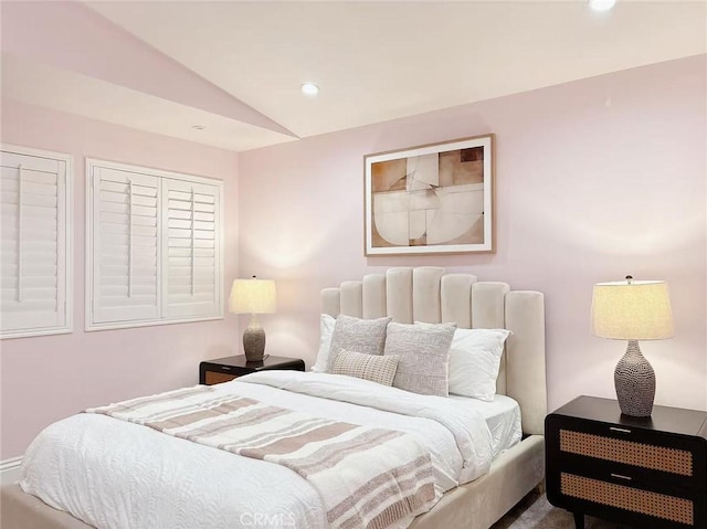 bedroom featuring recessed lighting and vaulted ceiling