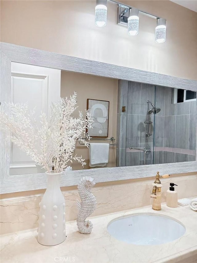 bathroom featuring vanity and a tile shower
