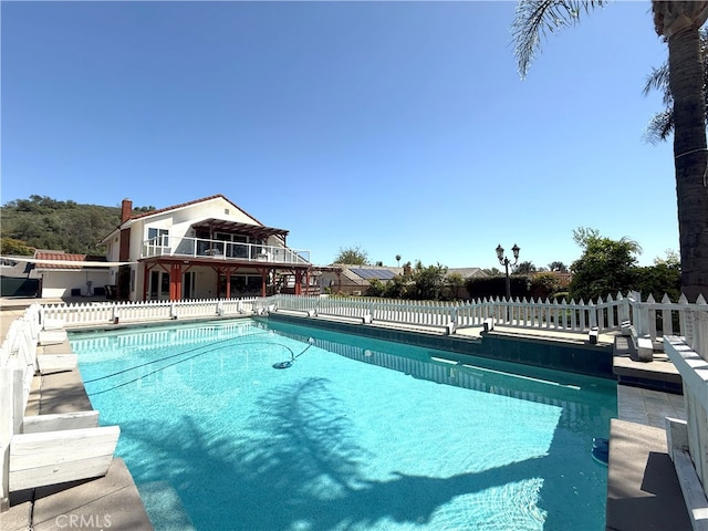 view of pool with fence and a fenced in pool