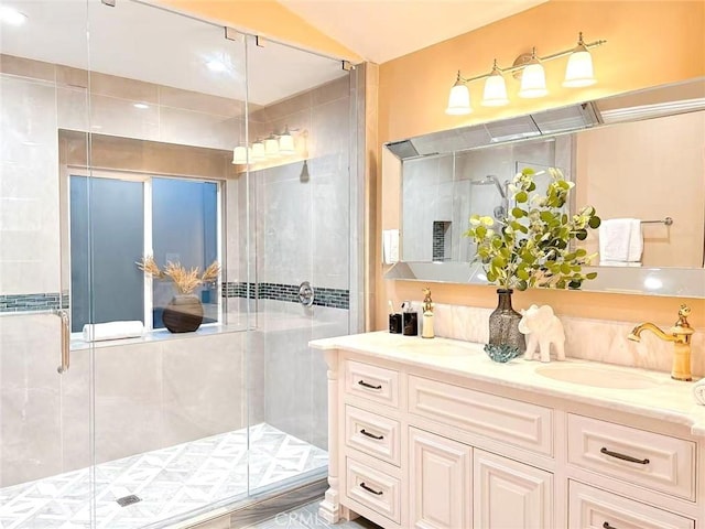 full bath with vanity and a stall shower